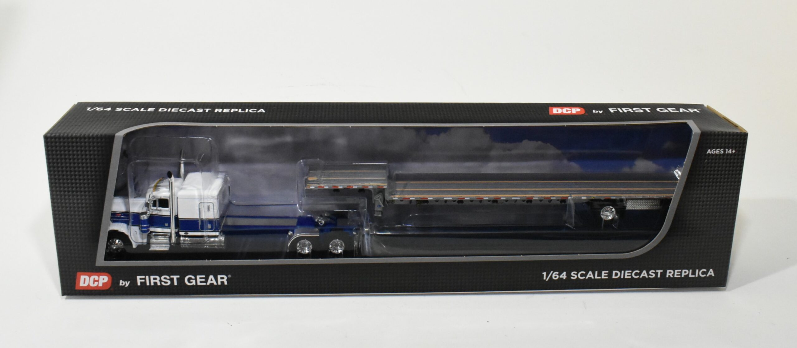 1/64 Blue/White Peterbilt 379 Semi With Transcraft Step Deck